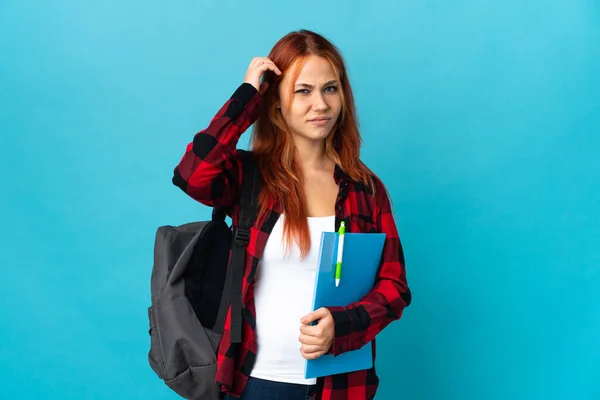 Adolescente Estudiante Ruso Chica Aislado Azul Fondo Teniendo Dudas — Foto de Stock