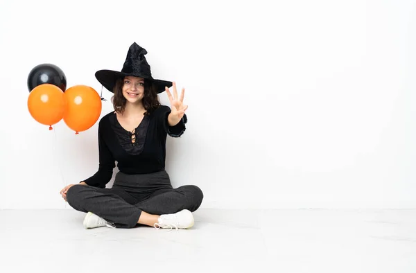 Young Witch Holding Black Orange Air Balloons Sitting Floor Happy — Stock Photo, Image