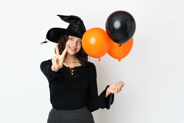 Young Witch Holding Black Orange Air Balloons Smiling Showing Victory — Stock Photo, Image