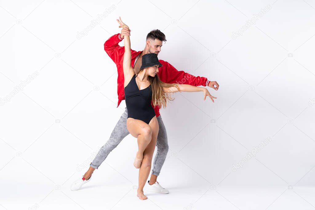 Couple dancing over isolated white background