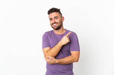 Caucasian man isolated on white background pointing to the side to present a product