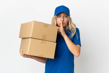 Young delivery woman isolated on white background showing a sign of silence gesture putting finger in mouth 