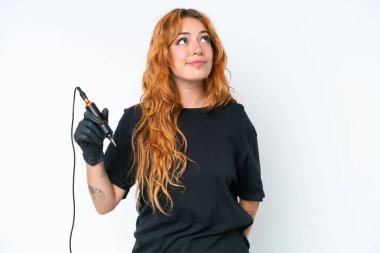 Tattoo artist caucasian woman isolated on white background and looking up
