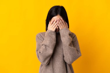 Young telemarketer woman isolated on yellow background with tired and sick expression