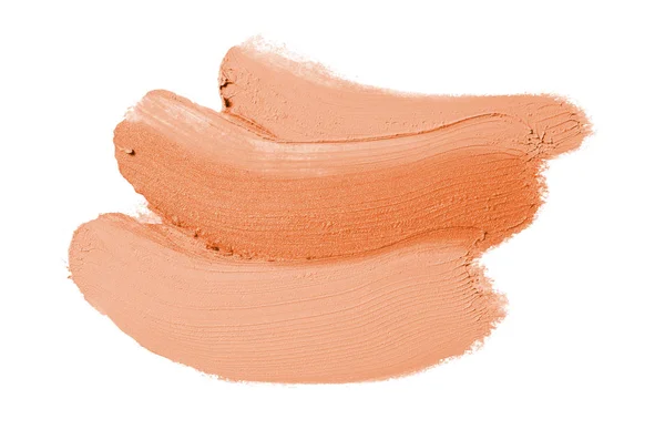 Spalmare e consistenza di rossetto o vernice acrilica isolata su sfondo bianco. Colore arancione — Foto Stock