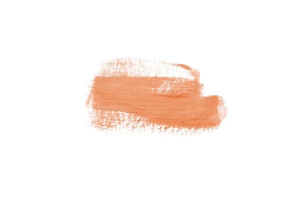 Rozmaz i tekstury szminki lub farby akrylowej na białym tle. Kolor pomarańczowy — Zdjęcie stockowe