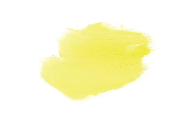 Мазок и текстура помады или акриловой краски изолированы на белом фоне. Желтый цвет — стоковое фото