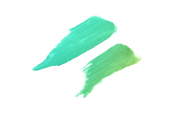 Smear en textuur van lippenstift of acrylverf geïsoleerd op witte achtergrond. Emerald kleur — Stockfoto