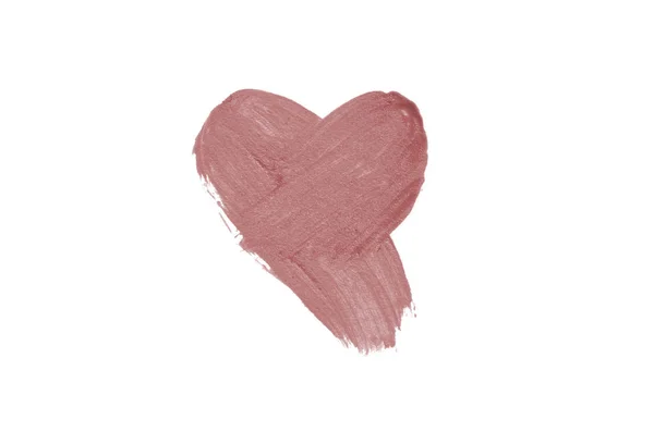 Liquid lipstick heart shape smudge isolated on white background.