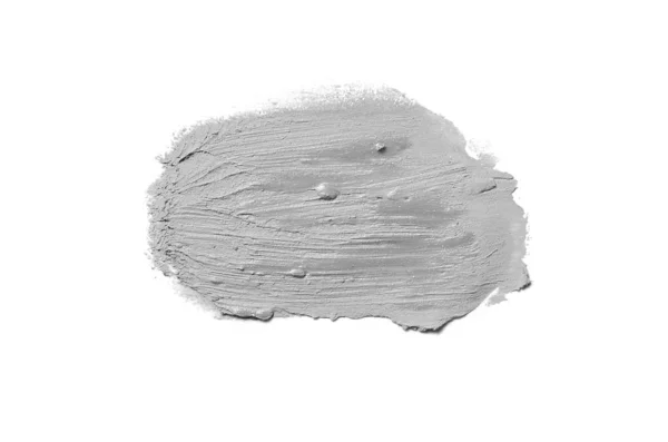 Spalmare e consistenza di rossetto o vernice acrilica isolata su sfondo bianco. Colore grigio — Foto Stock