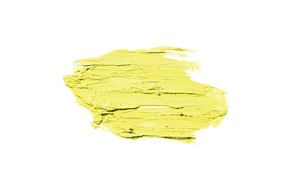 Мазок и текстура помады или акриловой краски изолированы на белом фоне. Желтый цвет — стоковое фото