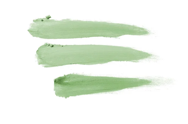 Smear en textuur van lippenstift of acrylverf geïsoleerd op witte achtergrond. Donker groene kleur — Stockfoto