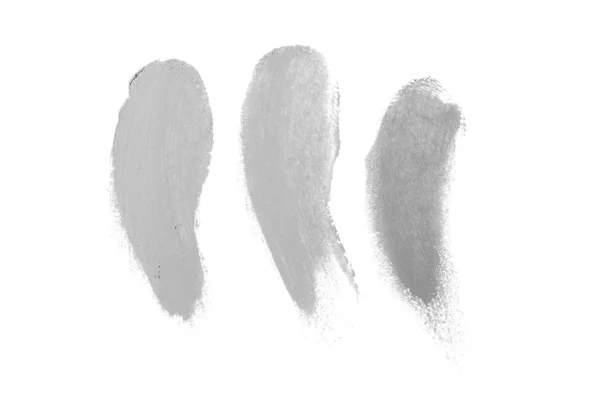 Rozmaz i tekstury szminki lub farby akrylowej na białym tle. Kolor szary — Zdjęcie stockowe