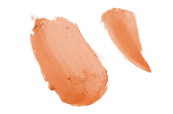 Smear en textuur van lippenstift of acrylverf geïsoleerd op witte achtergrond. Oranje kleur — Stockfoto