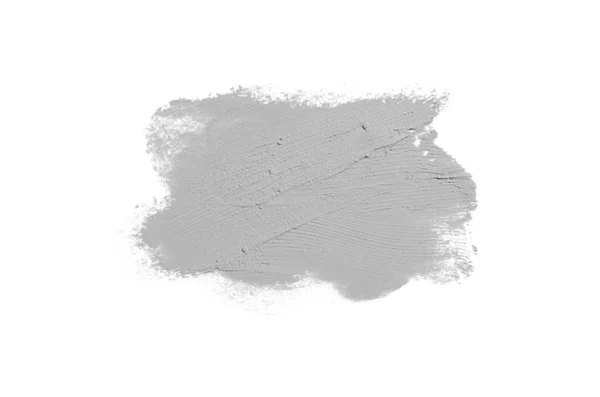 Mancha e textura de batom ou tinta acrílica isolada sobre fundo branco. Cor cinza — Fotografia de Stock
