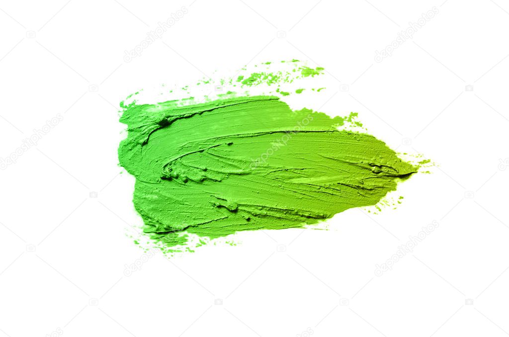 Smear and texture of lipstick or acrylic paint isolated on white background. Green yellow color