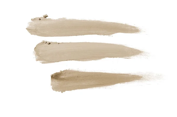 Rozmaz i tekstury szminki lub farby akrylowej na białym tle. Brązowy kolor — Zdjęcie stockowe