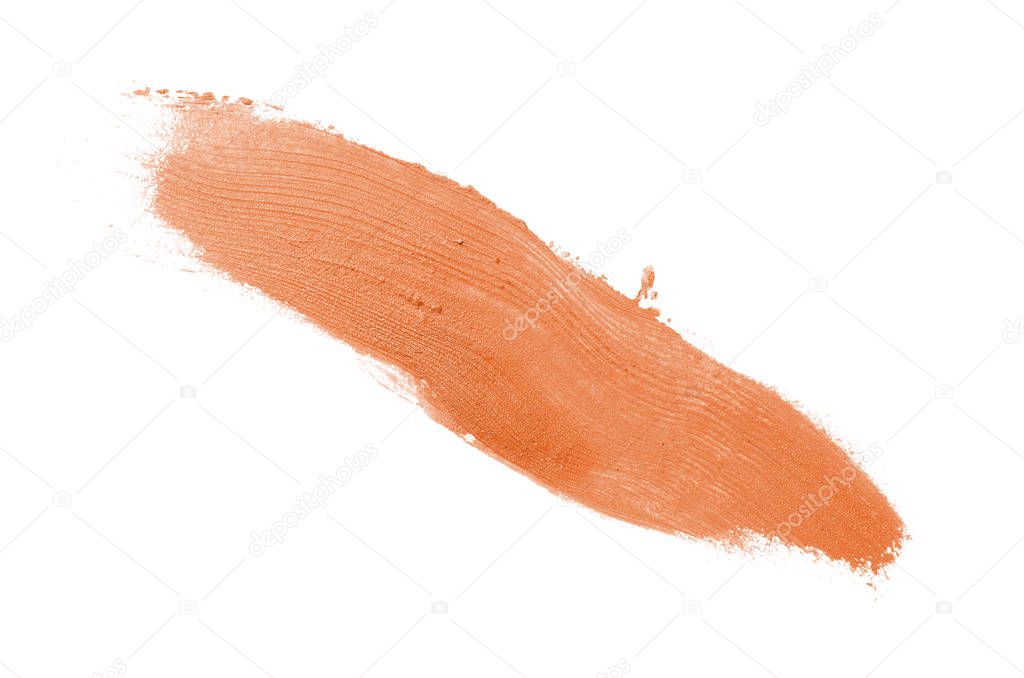Smear and texture of lipstick or acrylic paint isolated on white background. Orange color