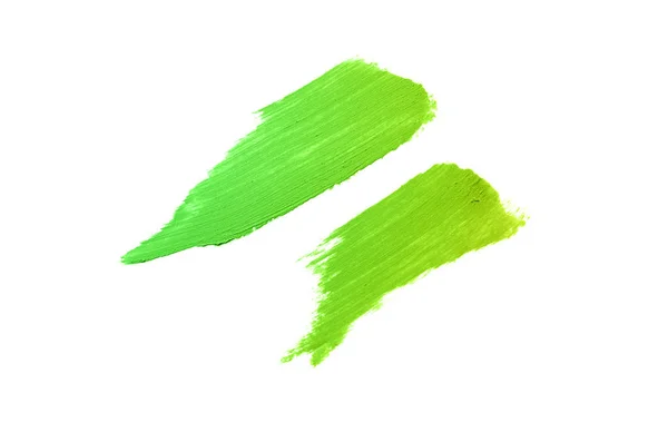Мазок и текстура помады или акриловой краски изолированы на белом фоне. Зеленый желтый цвет — стоковое фото