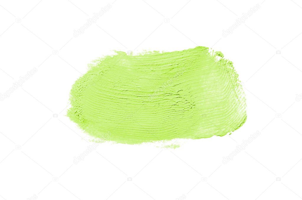 Smear and texture of lipstick or acrylic paint isolated on white background. Light green color