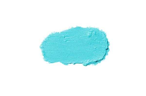 Rozmaz i tekstury szminki lub farby akrylowej na białym tle. Jasnoniebieski kolor — Zdjęcie stockowe