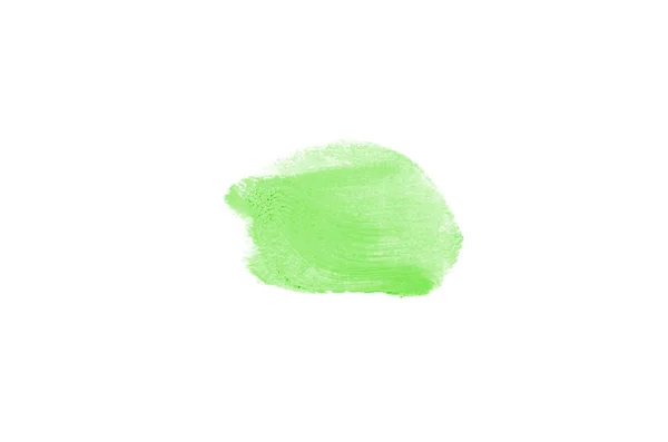 Frottis et texture de rouge à lèvres ou de peinture acrylique isolés sur fond blanc. Couleur verte — Photo
