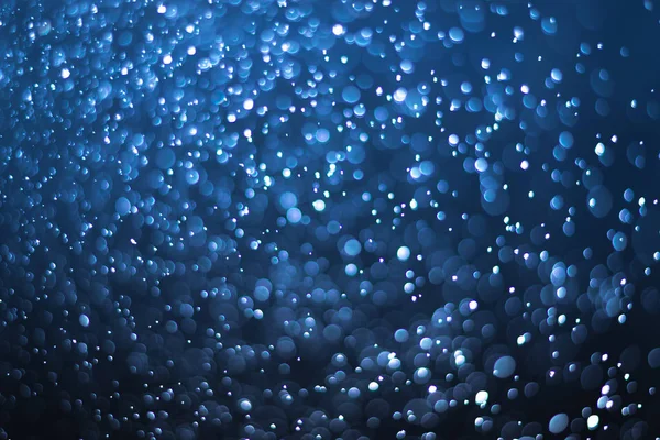 abstract dark deep blue background with soft blur bokeh light effect
