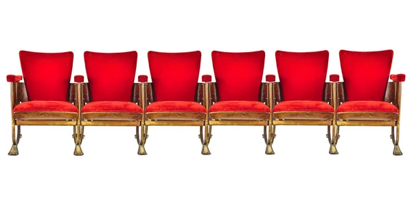 Row of six red vintage cinema chairs isolated on a white background