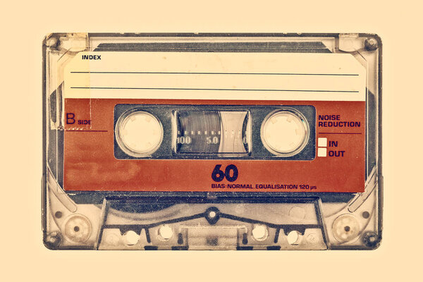 Retro style image of an old compact cassette with empty label
