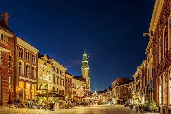 Bars and restaurants with christmas lights on the Houtmarkt square in Zutphen, The Netherlands