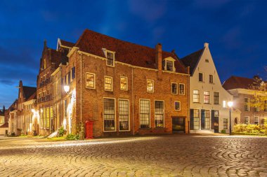 Evening view of medieval houses in the Dutch historic city centre of Deventer clipart