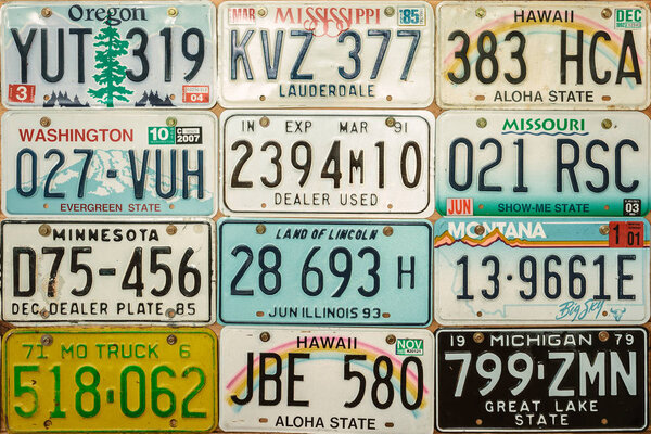 Vintage car license plates on a wall