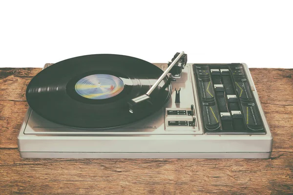 Old record player on a wooden table — Stock Photo, Image