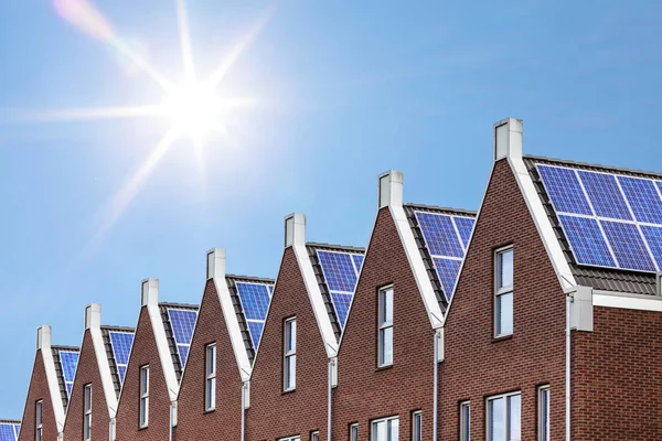 Newly build houses with solar panels attached on the roof