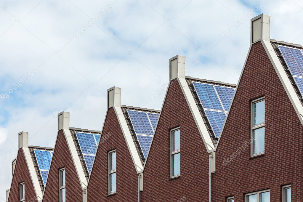 Dutch row of new houses with solar panels
