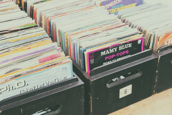 Wooden boxes with vinyl turntable records on an antique fifties — Stock Photo, Image