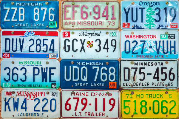 Vintage car license plates on a wall