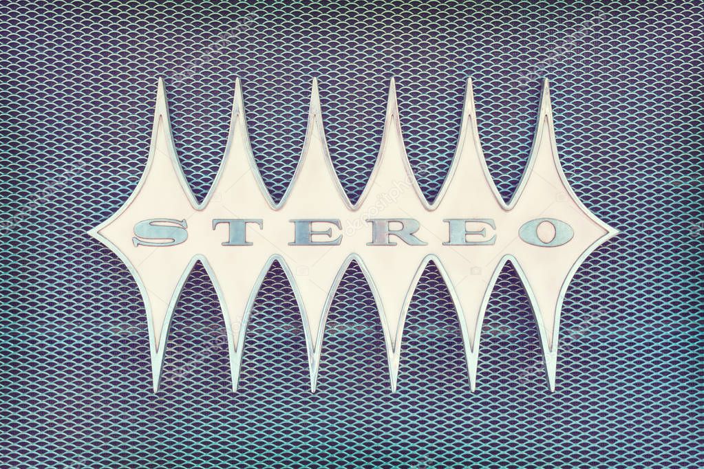 Close up of a vintage jukebox with the text stereo in metal