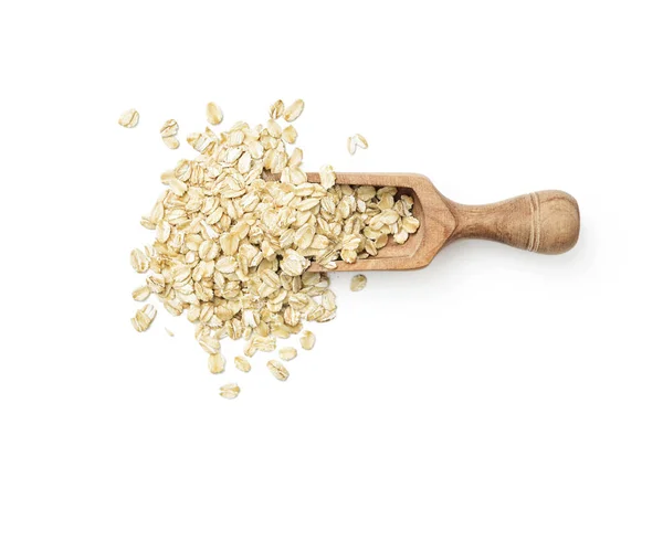 Oat flakes in wooden scoop — Stock Photo, Image