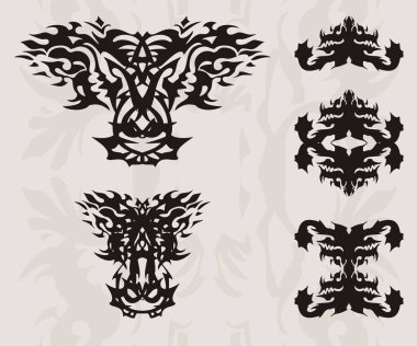 Soyut ateşli ejderha başlı ve siluetleri semboller bir ejderha. Çift siyah etnik ejderha sembolü ve tasarımınız için dekoratif gri arka plan üzerinde bir ejderha closeup Başkanı