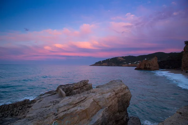 beach with rocks and sky with effects of photography