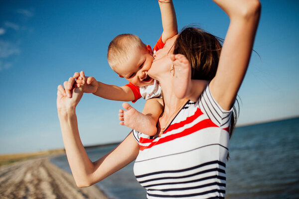 Funny portrait of a happy family on the beach.