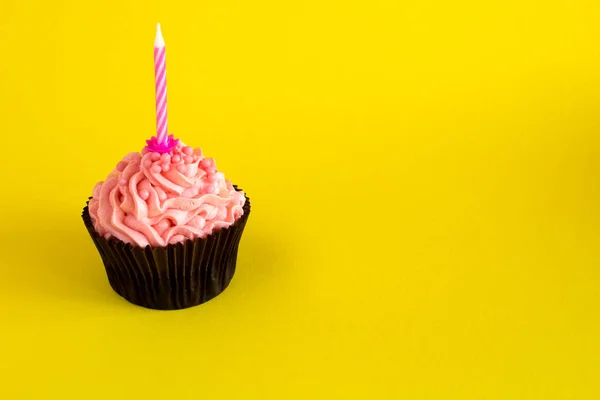 One Cupcake Pink Cream Candle Yellow Background Copy Space — Stock Photo, Image