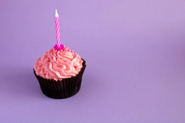 One Cupcake Pink Cream Candle Violet Background Copy Space — Stock Photo, Image