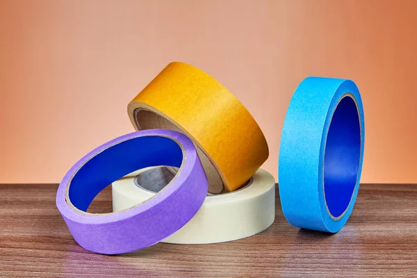 Four Multicolored Rolls Adhesive Tape Various Purposes Lie Table — Stock Photo, Image