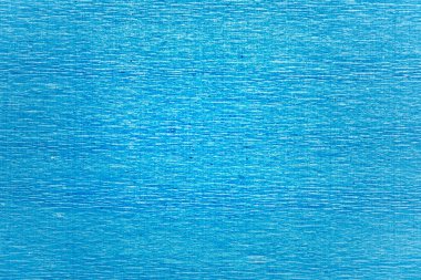 Mavi arka plan dokusu bol dökümlü kağıt buruşuk.