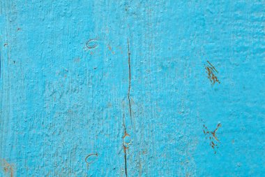 Eski püskü ahşap masa, boyalı arka plan için doku yüzeyi ışık mavi renkte.