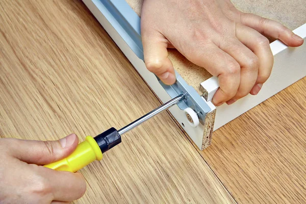 Handyman Assembling Furniture Hand Screwdriver Tightening Screws Side Drawer Closeup — Stock Photo, Image