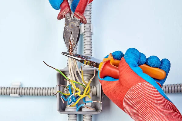 Electrician is joining wires together by work tools. — Stock Photo, Image