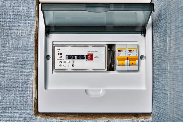 stock image Electric meter is mounted at main electrical panel.